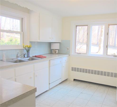 221 Lincoln Road Lincoln, MA 01773 - Photo 3 of 17 a kitchen with a sink window and cabinets
