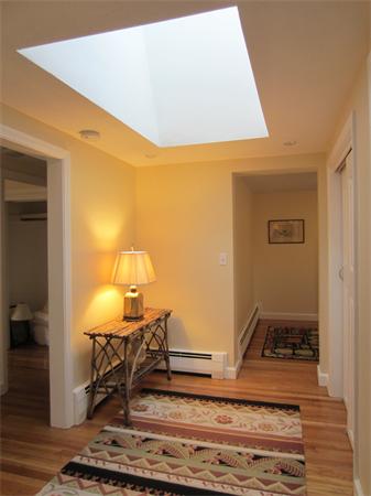 221 Lincoln Road Lincoln, MA 01773 - Photo 6 of 17 a living room with a rug