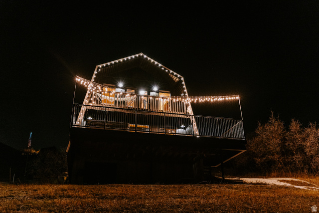 1413 Basel Drive Midway, UT 84049 - Photo 111 of 137 Back of house at night featuring a deck