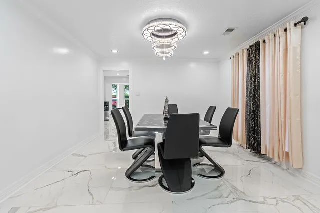 a view of a dining room with furniture