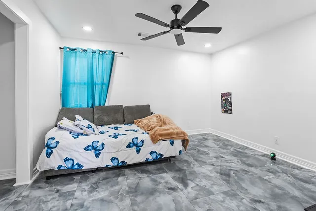 a bedroom with a bed and a dresser