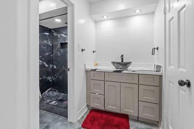 a view of a sink and cabinets