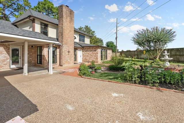 a view of a swimming pool with a yard