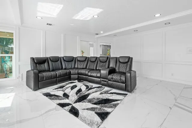 a living room with furniture and a couch