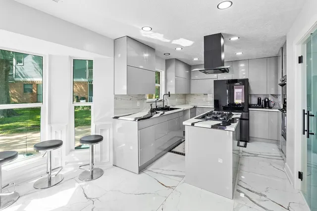 a kitchen with counter top space cabinets and stainless steel appliances