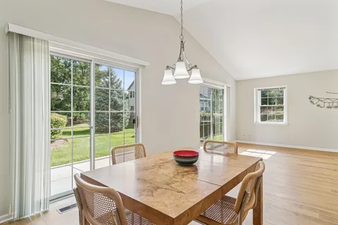 a view of a dining room with furniture window and outside view