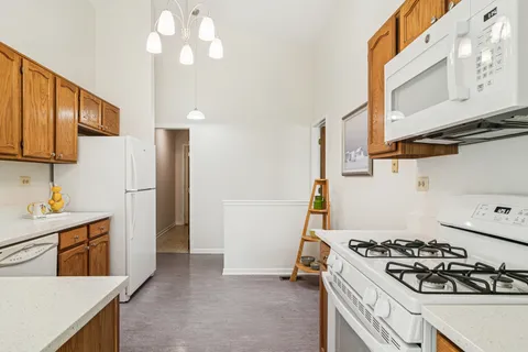 a kitchen with a stove and a refrigerator
