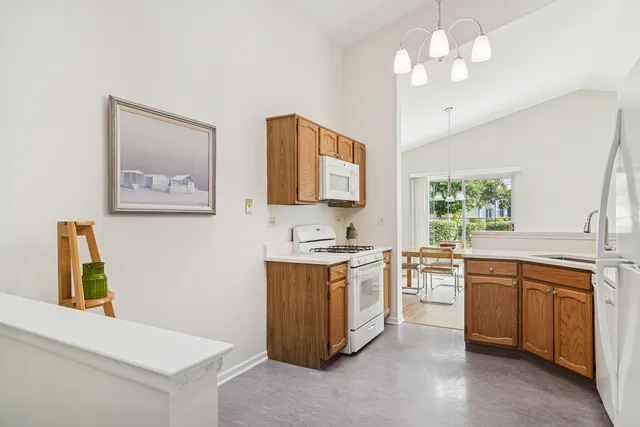 a kitchen with stainless steel appliances granite countertop a stove and a sink
