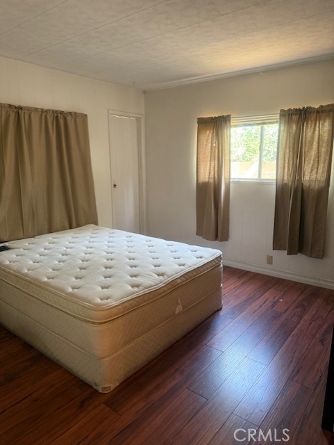 3050 West Ball Road, Unit 171 Anaheim, CA 92804 - Photo 8 of 15 a bed sitting in a spacious bedroom next to a window