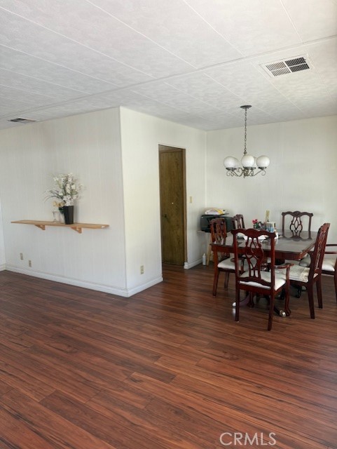 3050 West Ball Road, Unit 171 Anaheim, CA 92804 - Photo 10 of 15 a view of a dining room with furniture and wooden floor