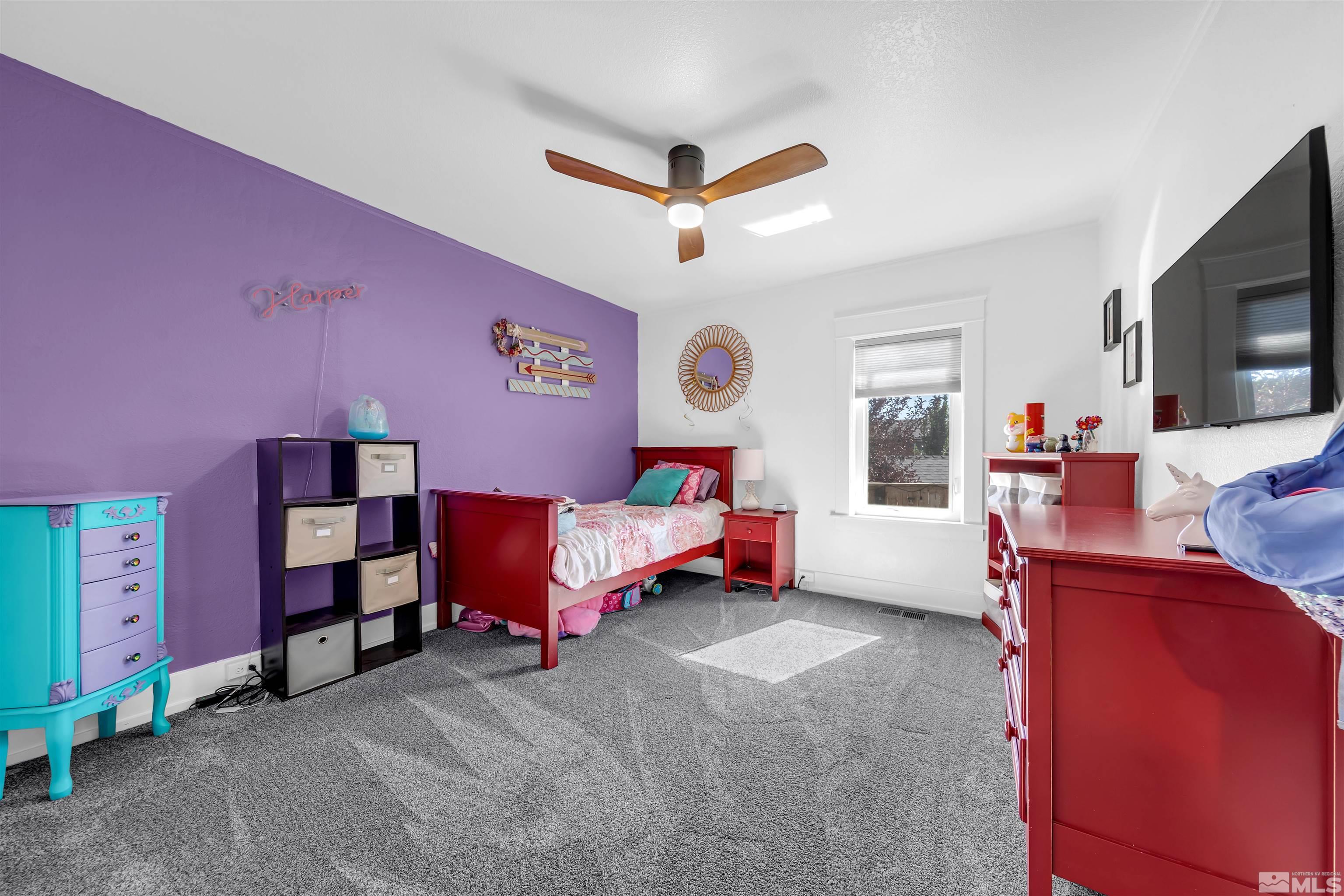 128 Stewart Street Reno, NV 89501 - Photo 18 of 24 a bedroom with a bed and a tv