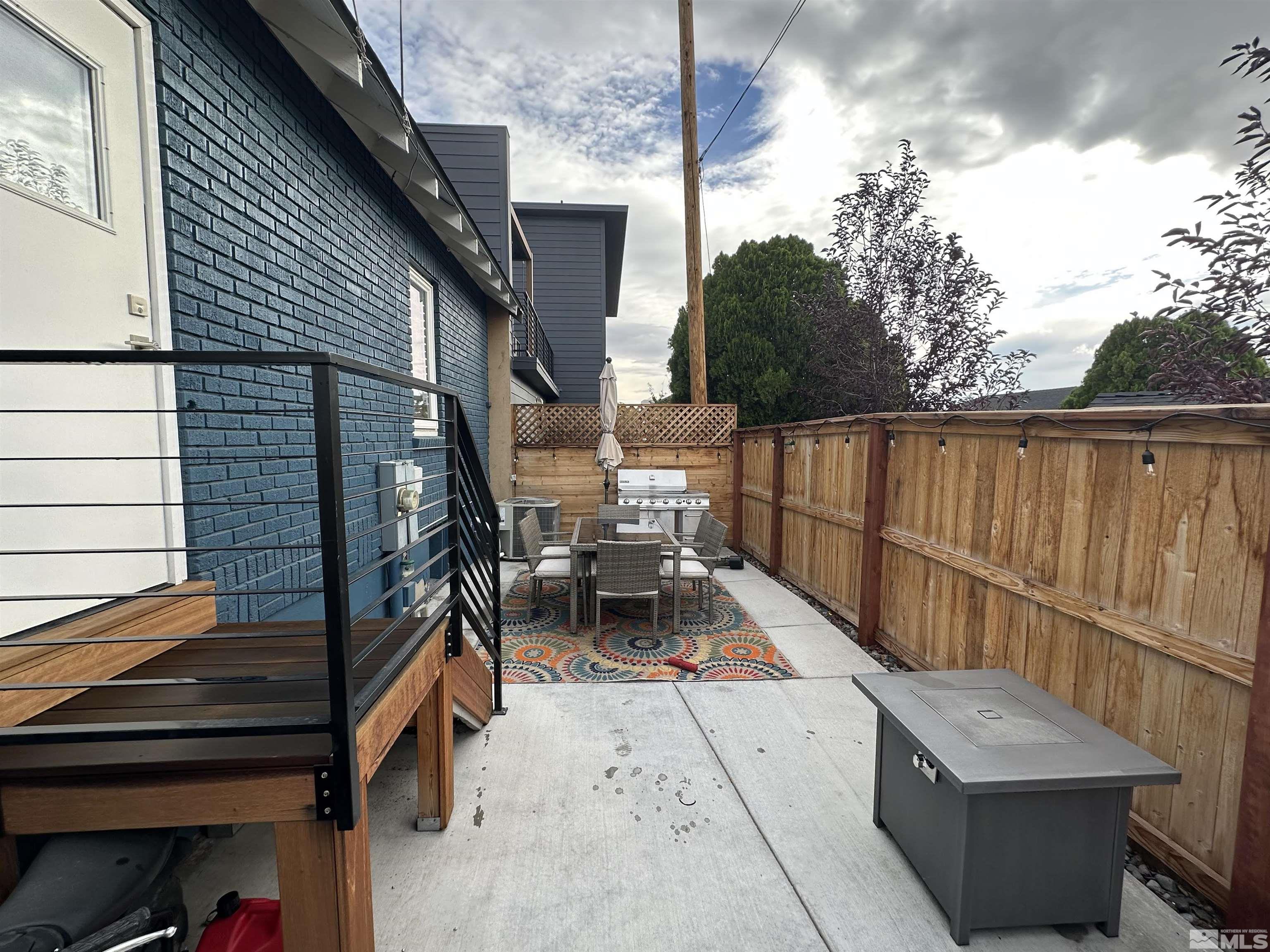 128 Stewart Street Reno, NV 89501 - Photo 4 of 24 a balcony with wooden floor and outdoor seating