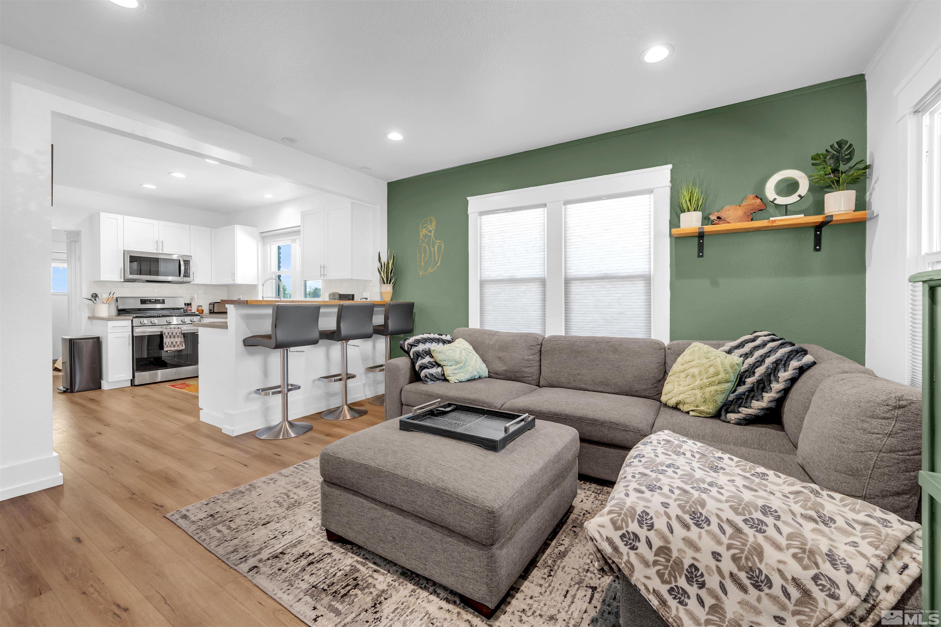 128 Stewart Street Reno, NV 89501 - Photo 7 of 24 a living room with furniture and kitchen view