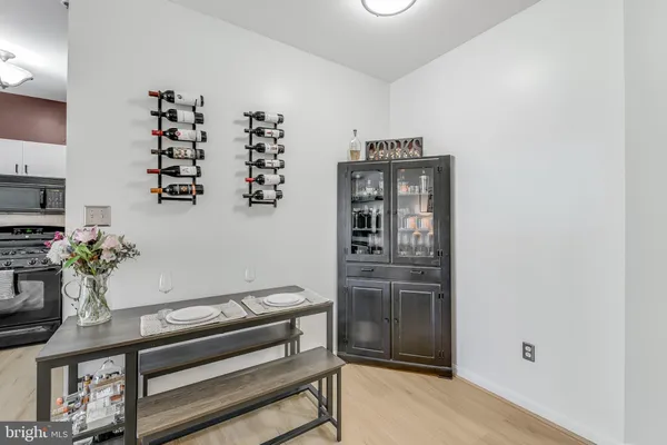 a kitchen with granite countertop a stove and a refrigerator