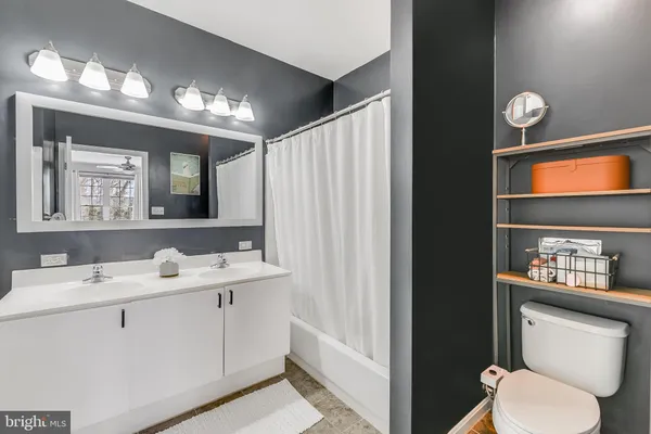 a room with a bed and a window