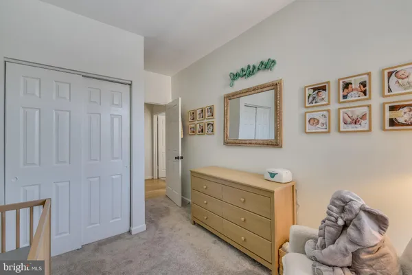 a view of living room with furniture and wooden floor