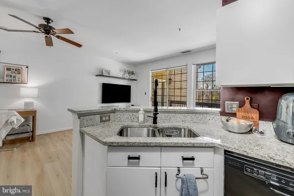 a kitchen with sink and window