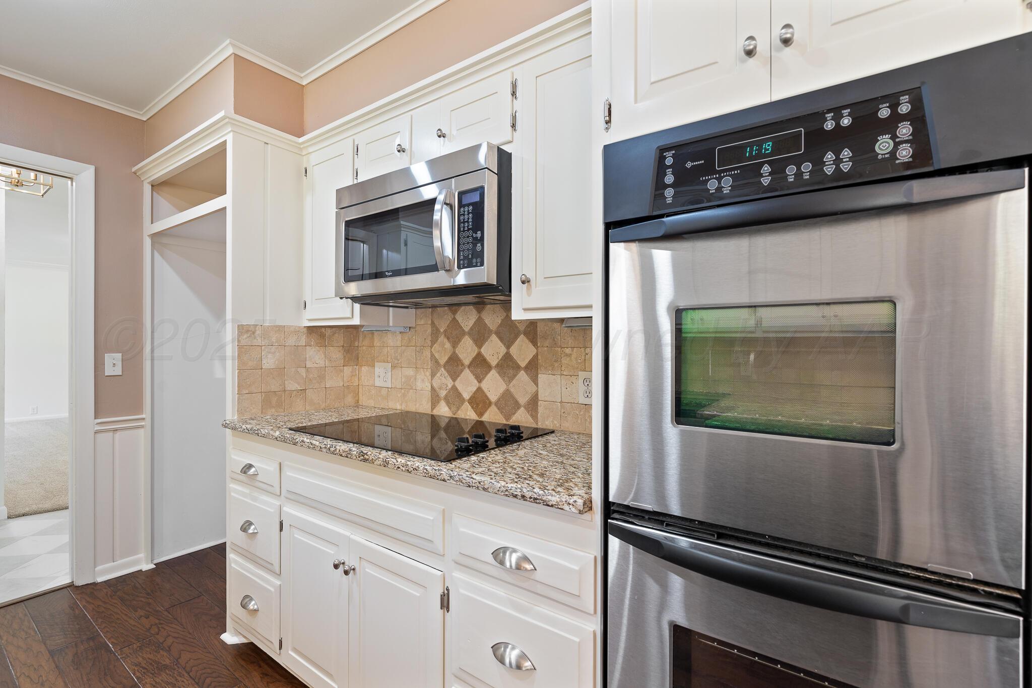 3804 Doris Drive Amarillo, TX 79109 - Photo 16 of 53 a kitchen with granite countertop stainless steel appliances and cabinets