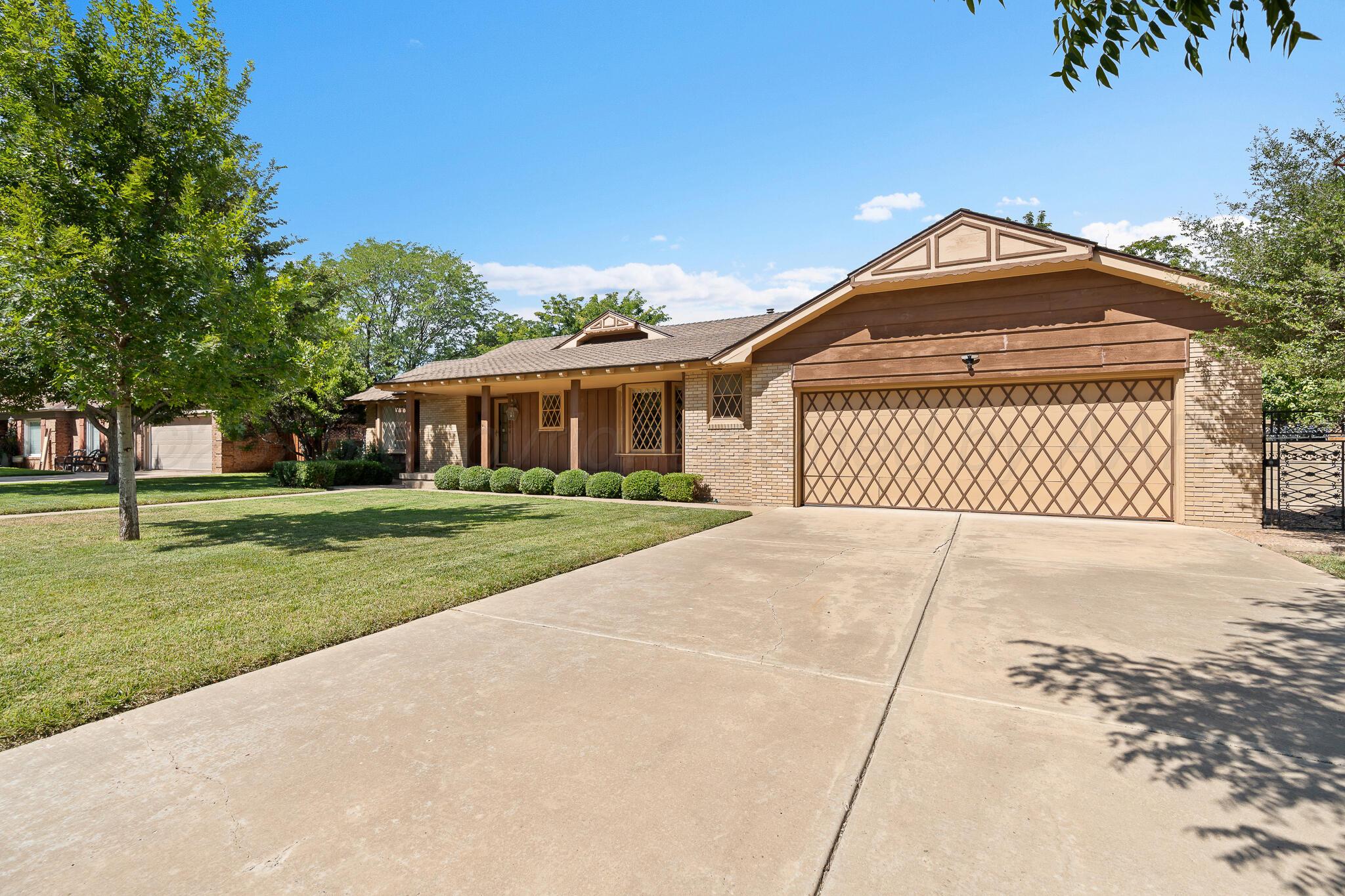 3804 Doris Drive Amarillo, TX 79109 - Photo 2 of 53 a front view of a house with a yard
