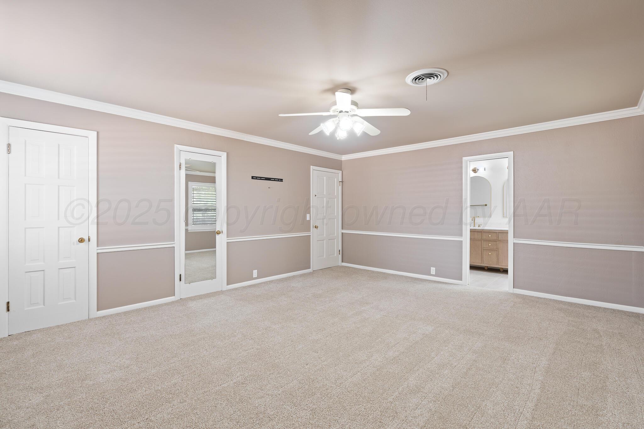 3804 Doris Drive Amarillo, TX 79109 - Photo 24 of 53 a view of an empty room with a ceiling fan
