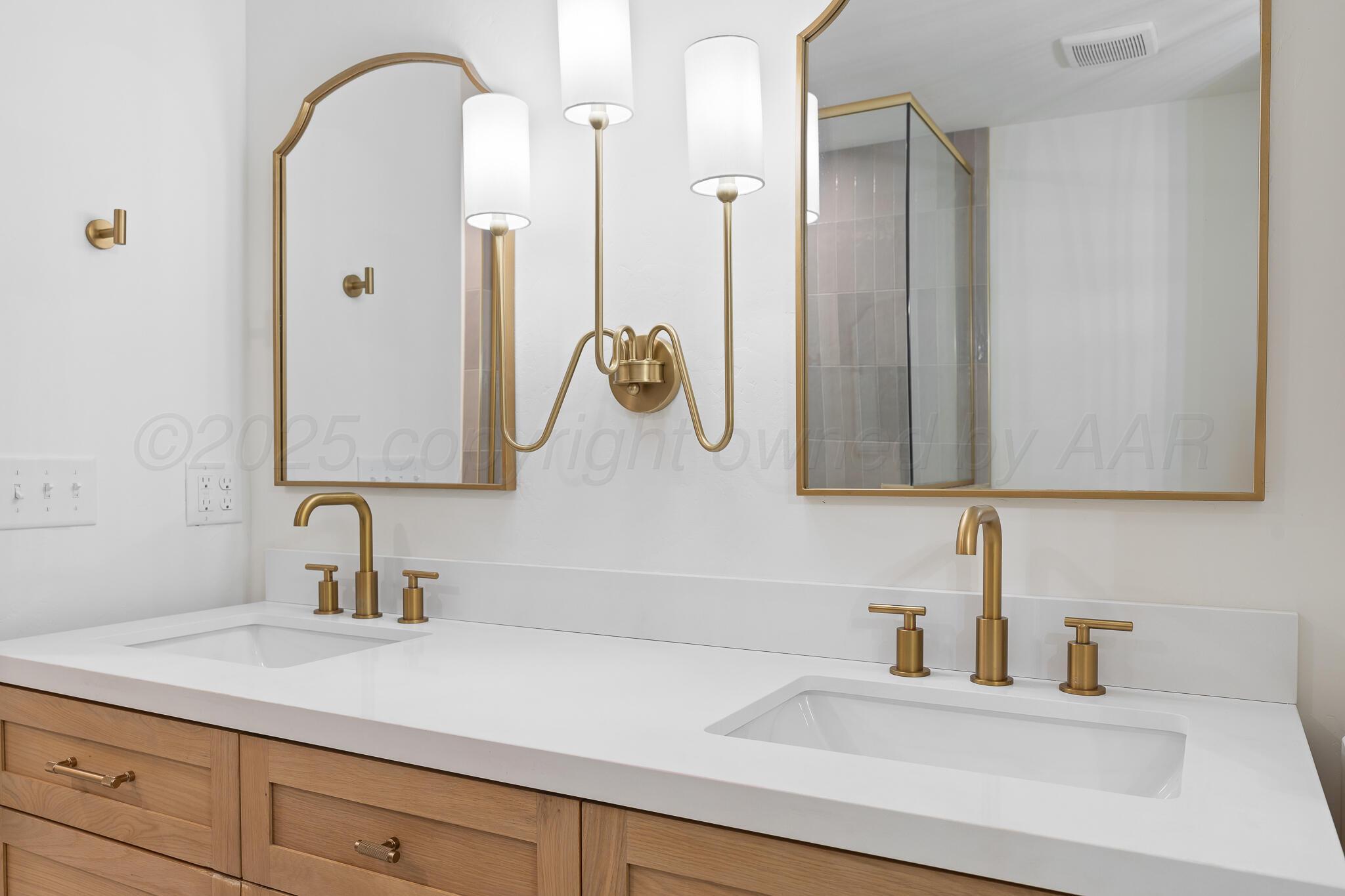3804 Doris Drive Amarillo, TX 79109 - Photo 38 of 53 a bathroom with a sink and a mirror