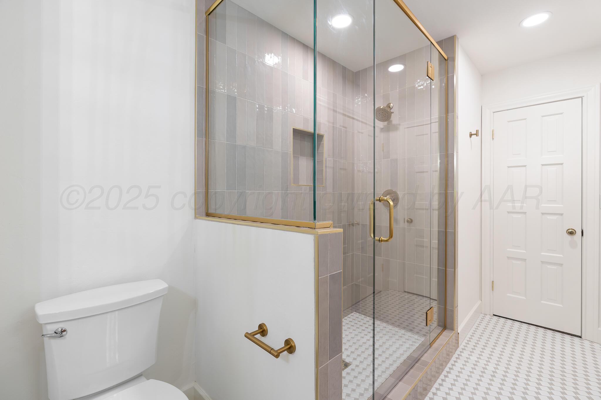 3804 Doris Drive Amarillo, TX 79109 - Photo 40 of 53 a bathroom with a shower and toilet