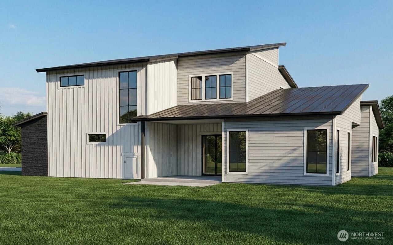 180 Chadwick Street Northwest East Wenatchee, WA 98802 - Photo 3 of 8 a front view of a house with a garden