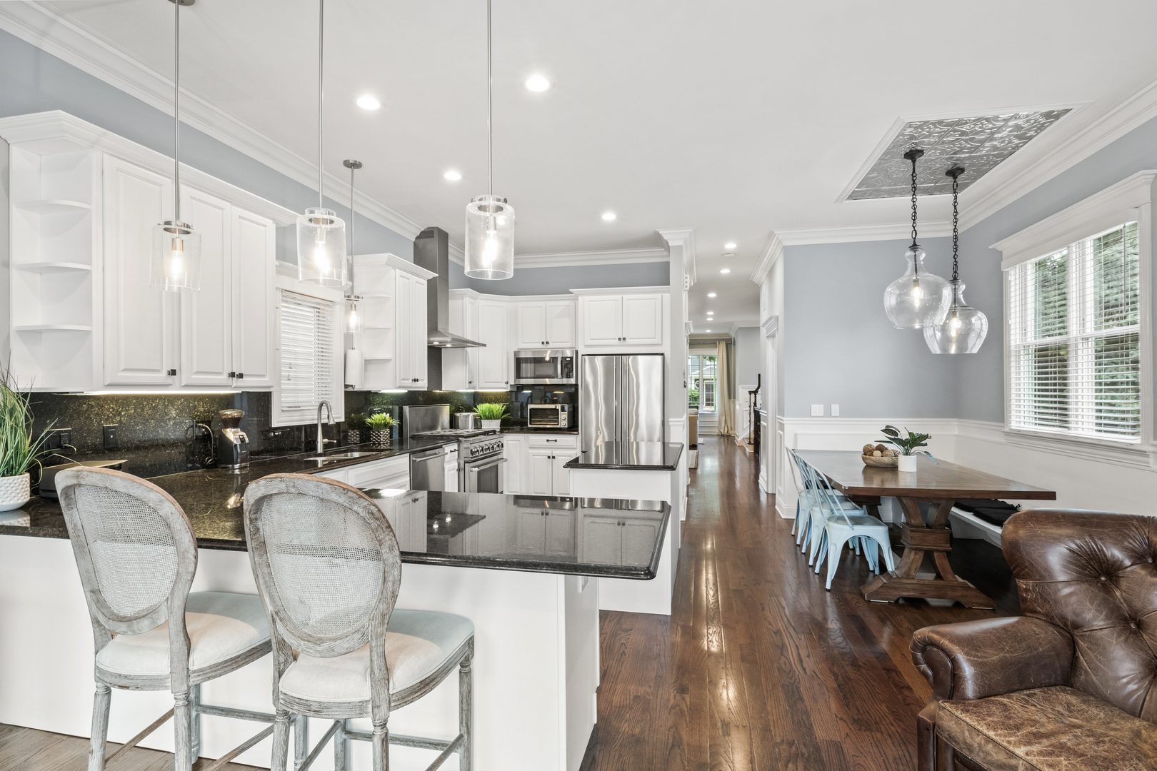 3743 North Ridgeway Avenue Chicago, IL 60618 - Photo 15 of 65 a large kitchen with a table and chairs