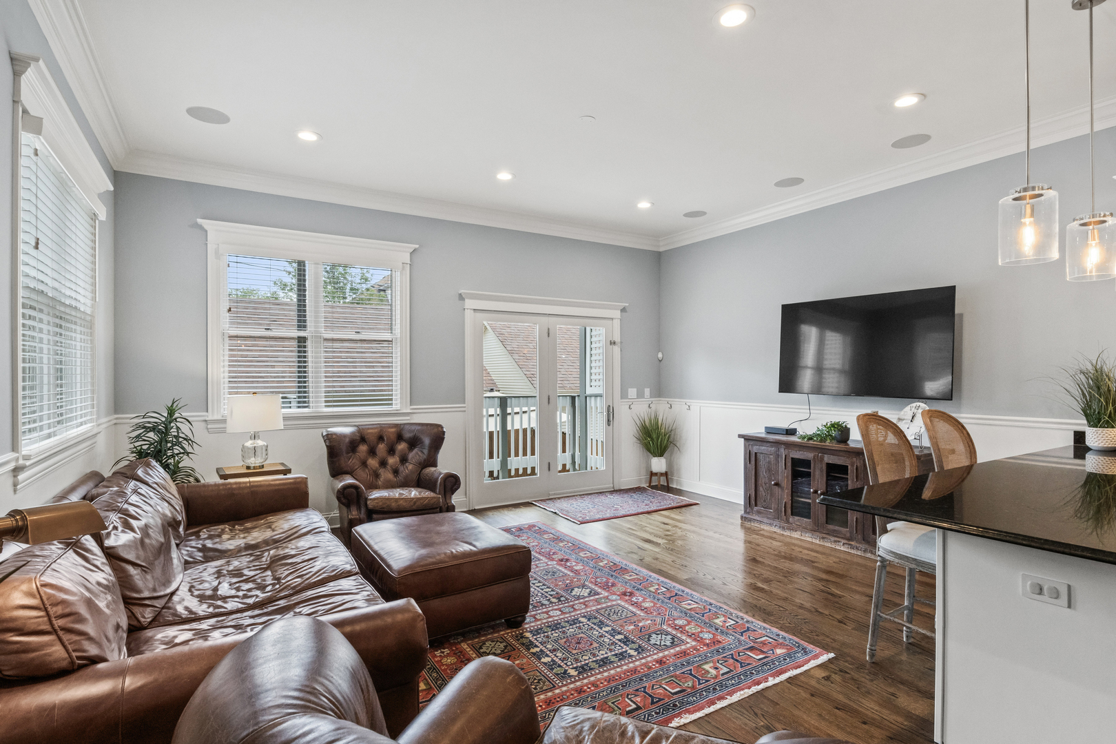 3743 North Ridgeway Avenue Chicago, IL 60618 - Photo 20 of 65 a living room with furniture and a flat screen tv