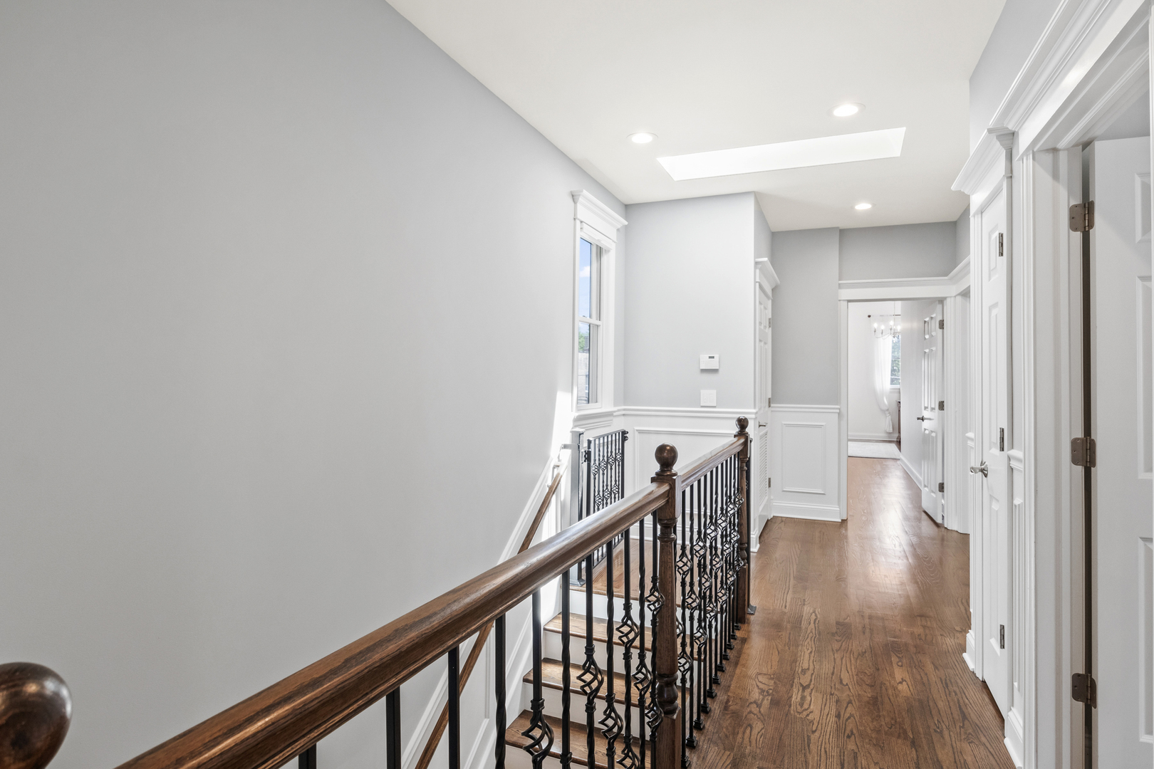 3743 North Ridgeway Avenue Chicago, IL 60618 - Photo 24 of 65 a view of a hallway with wooden floor and staircase
