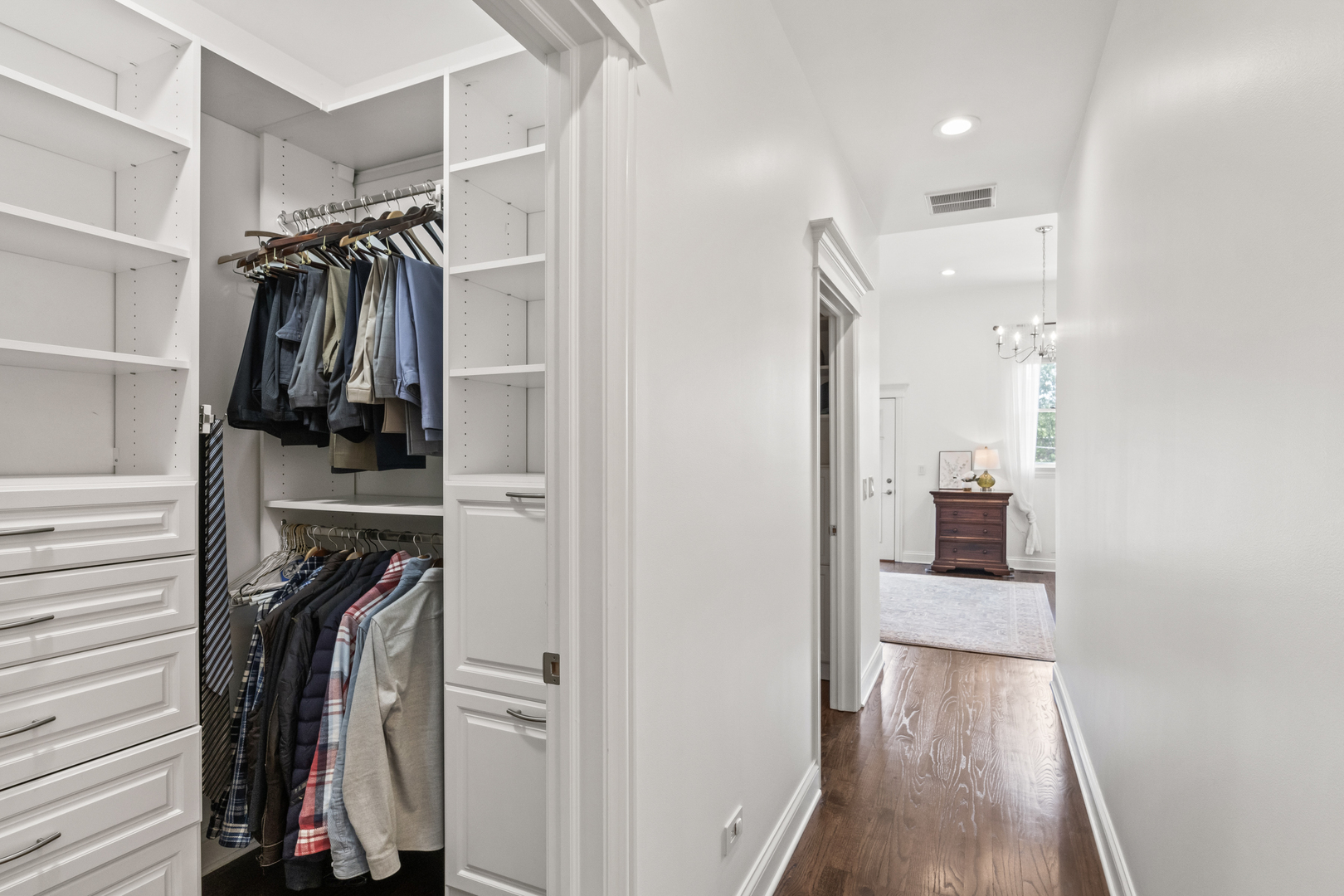 3743 North Ridgeway Avenue Chicago, IL 60618 - Photo 32 of 65 a view of walk in closet with clothes and shoes