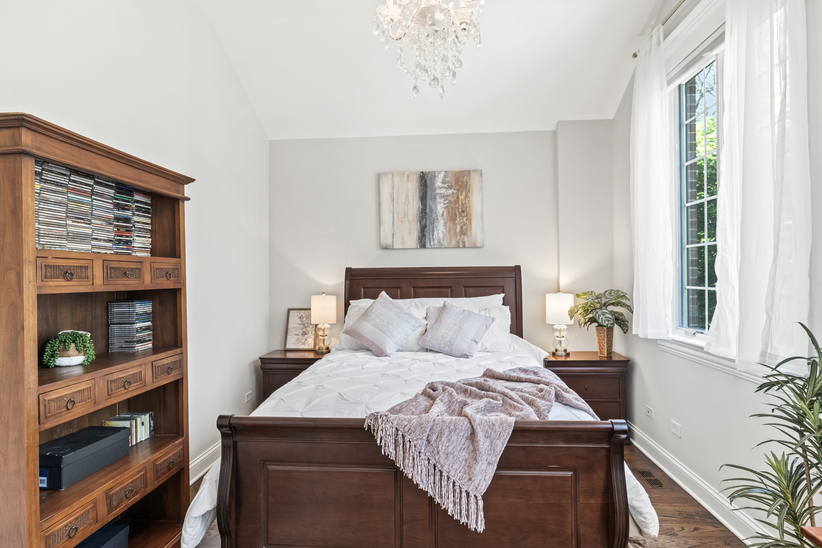 3743 North Ridgeway Avenue Chicago, IL 60618 - Photo 34 of 65 a bed sitting in a bedroom next to a window