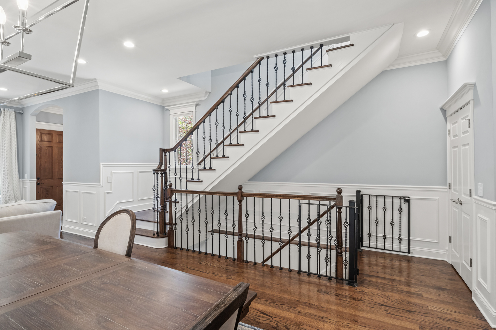 3743 North Ridgeway Avenue Chicago, IL 60618 - Photo 39 of 65 a view of staircase with railing and a chandelier
