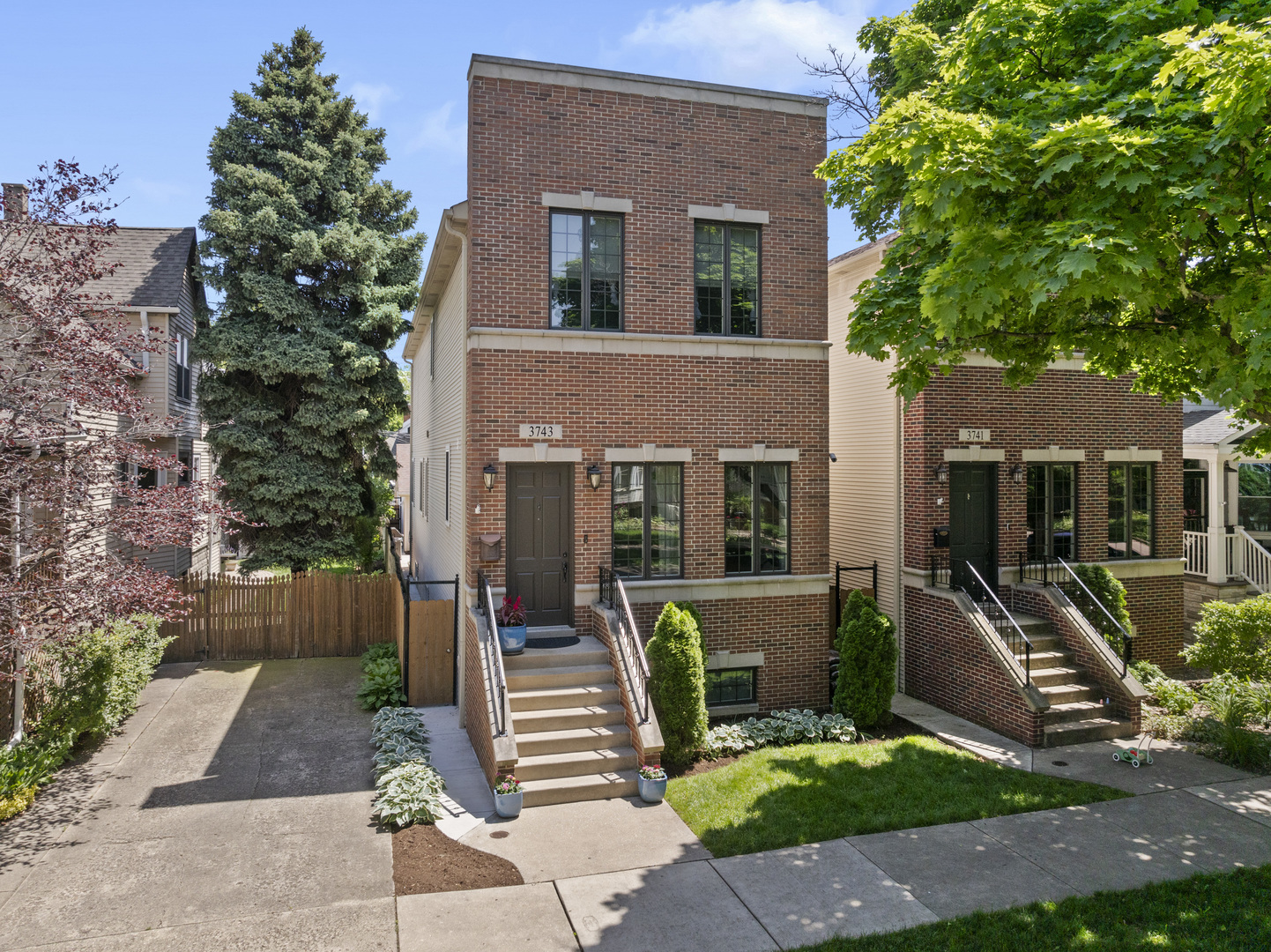 3743 North Ridgeway Avenue Chicago, IL 60618 - Photo 4 of 65 a front view of a house with garden