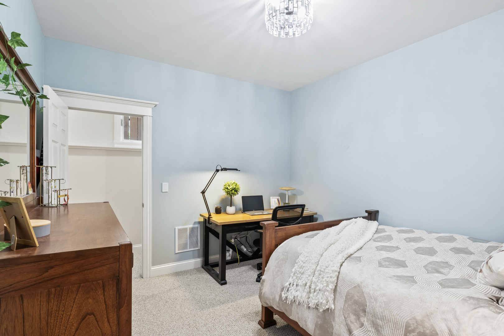 3743 North Ridgeway Avenue Chicago, IL 60618 - Photo 45 of 65 a bedroom with a bed and a table in it