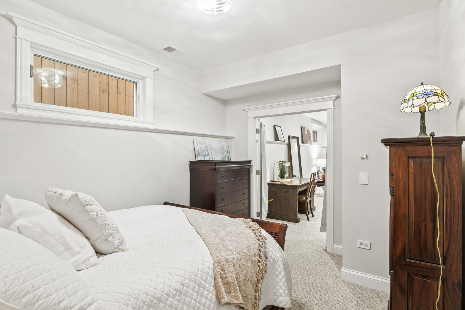 3743 North Ridgeway Avenue Chicago, IL 60618 - Photo 47 of 65 a bedroom with a bed and a chandelier