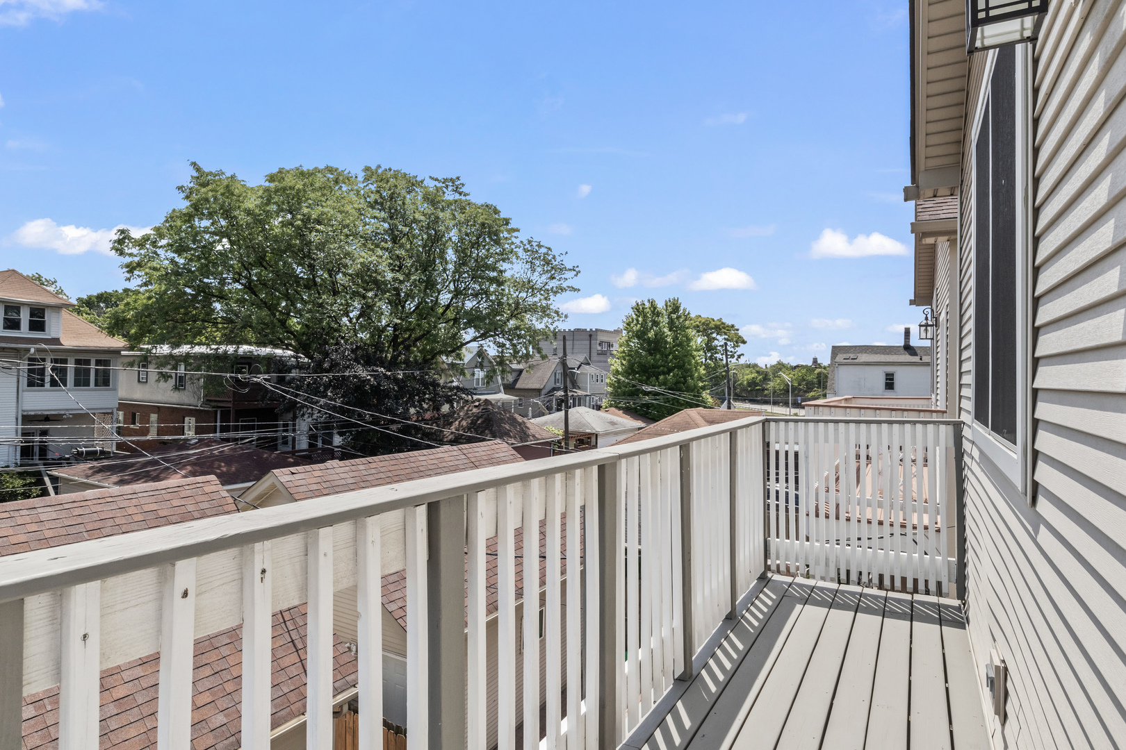 3743 North Ridgeway Avenue Chicago, IL 60618 - Photo 53 of 65 a view of a wooden street from a balcony