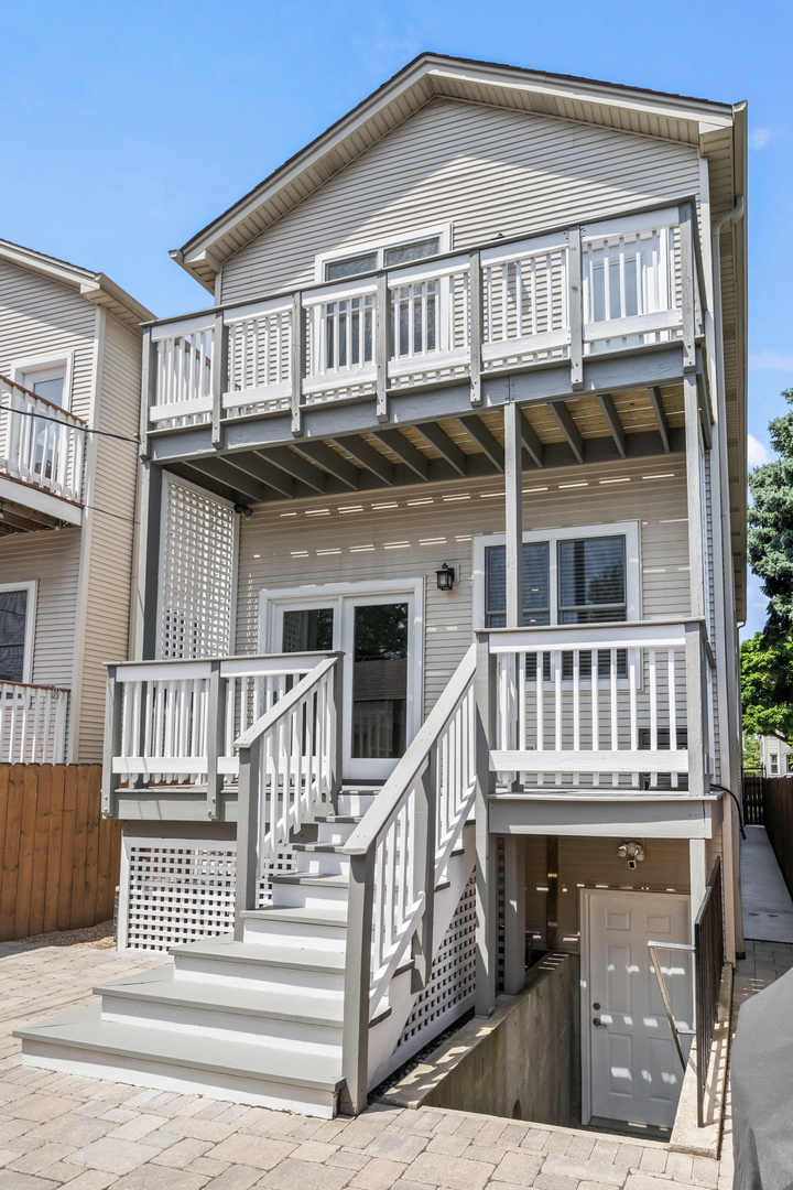 3743 North Ridgeway Avenue Chicago, IL 60618 - Photo 54 of 65 a front view of a house with a porch