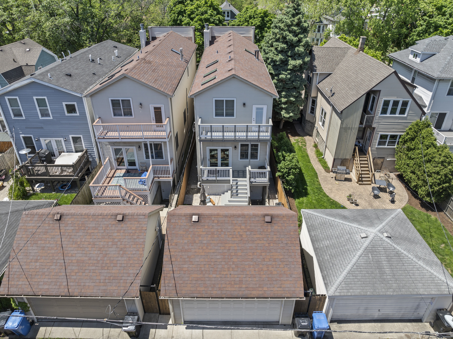 3743 North Ridgeway Avenue Chicago, IL 60618 - Photo 57 of 65 an aerial view of residential houses with outdoor space and car parked