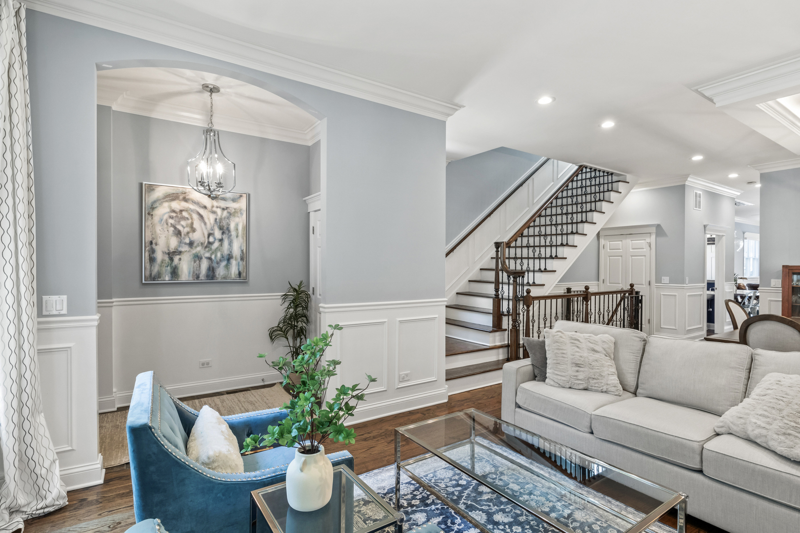 3743 North Ridgeway Avenue Chicago, IL 60618 - Photo 6 of 65 a living room with furniture and a chandelier