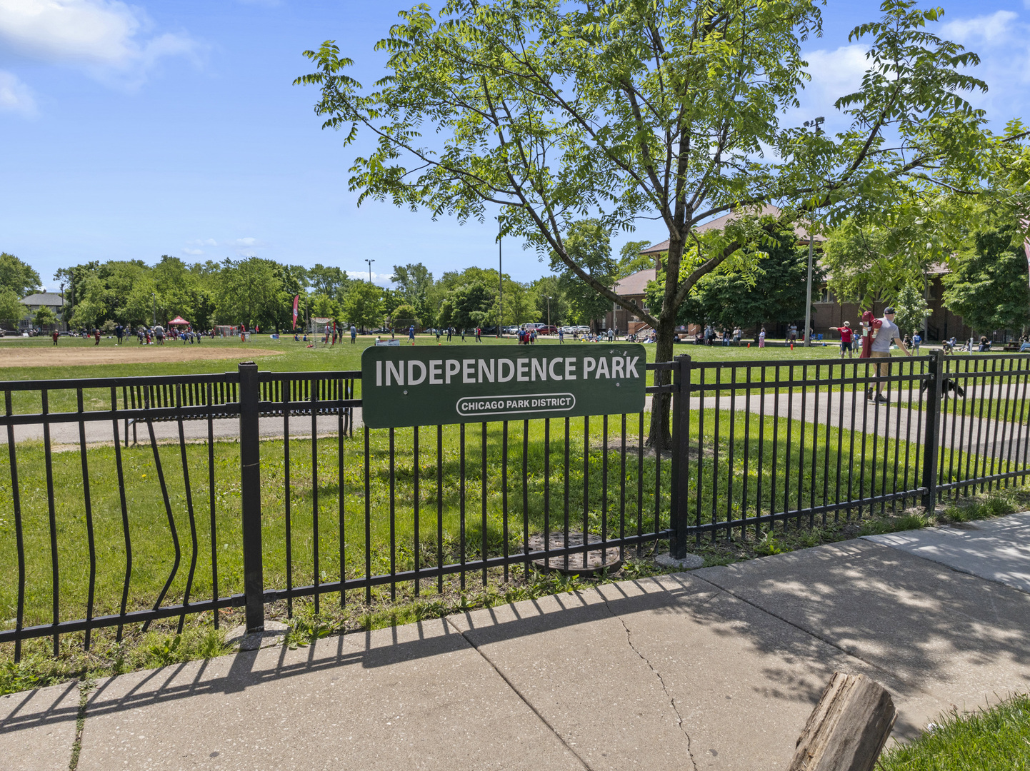 3743 North Ridgeway Avenue Chicago, IL 60618 - Photo 64 of 65 a view of a street gate and trees