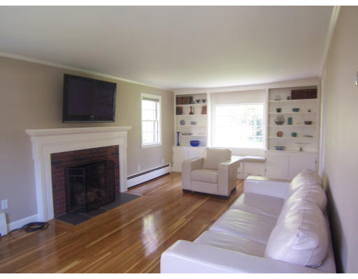 38 Governors Road Milton, MA 02186 - Photo 3 of 15 a living room with furniture and a fireplace