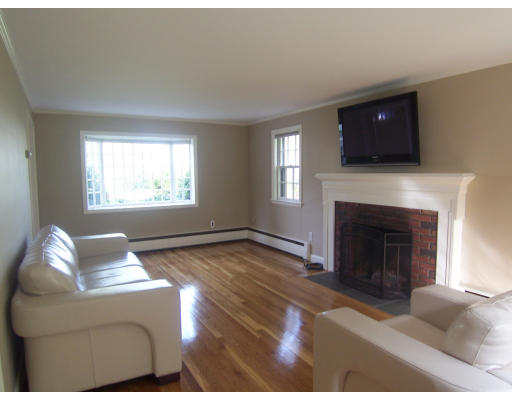 38 Governors Road Milton, MA 02186 - Photo 4 of 15 a living room with furniture and a fireplace