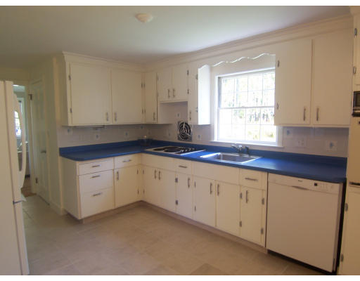 38 Governors Road Milton, MA 02186 - Photo 8 of 15 a kitchen with granite countertop white cabinets sink and window