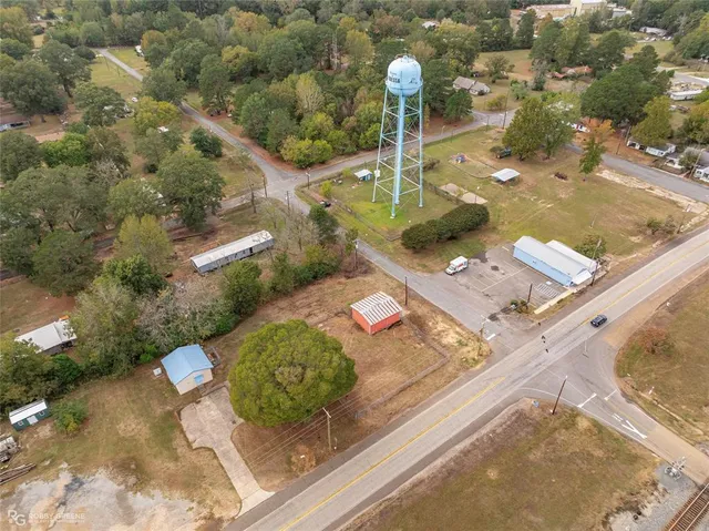 a house view with swimming pool in front of it