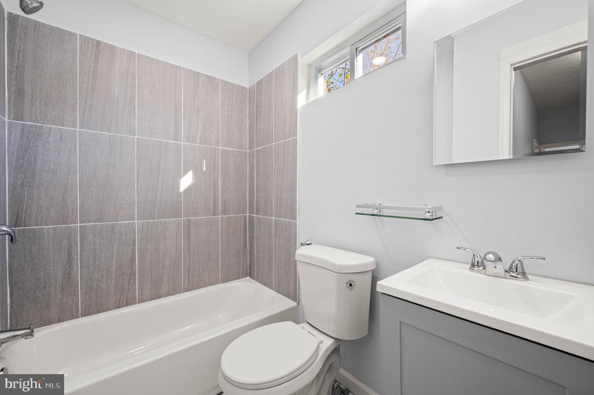 2139 North 10th Street Philadelphia, PA 19122 - Photo 14 of 20 a bathroom with a sink a toilet and shower