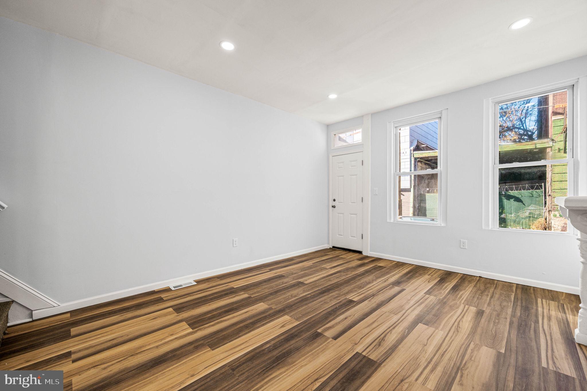 2139 North 10th Street Philadelphia, PA 19122 - Photo 7 of 20 a view of room with window and wooden floor