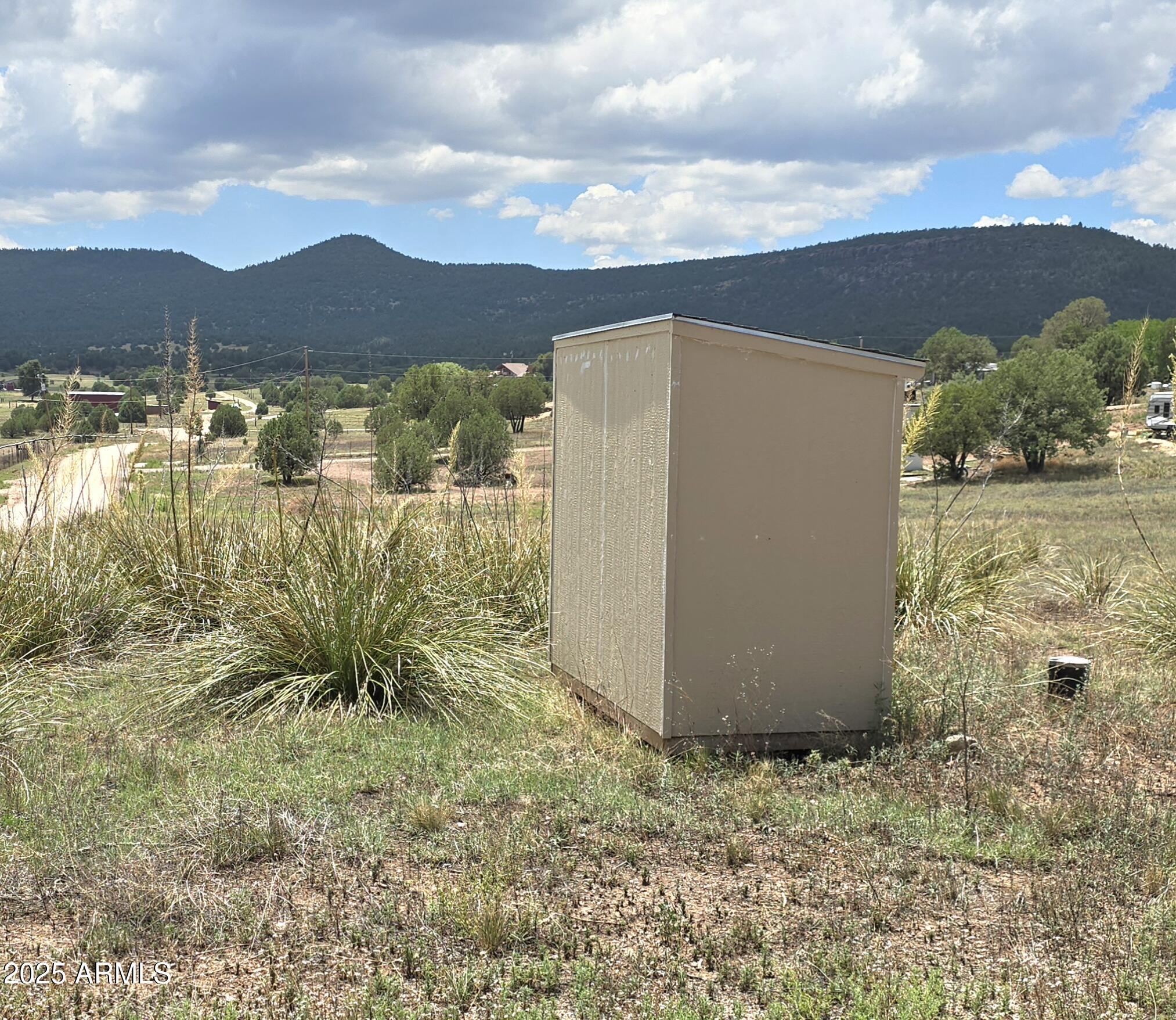 410 Rolling Hills Road, Unit 1&2 Young, AZ 85554 - Photo 7 of 8 a view of a lake with a mountain in the background