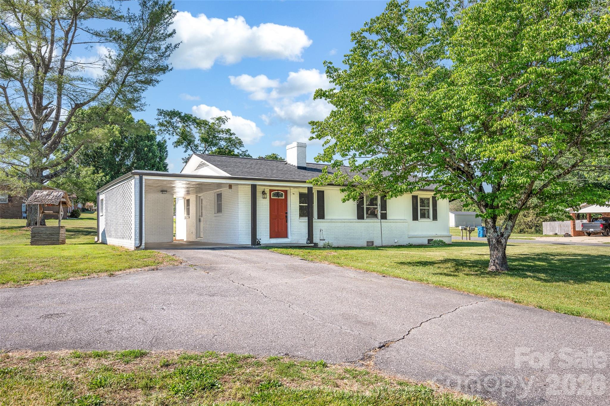 3033 West Highway 10 Conover, NC 28613 - Photo 1 of 26 a front view of a house with a yard and garage