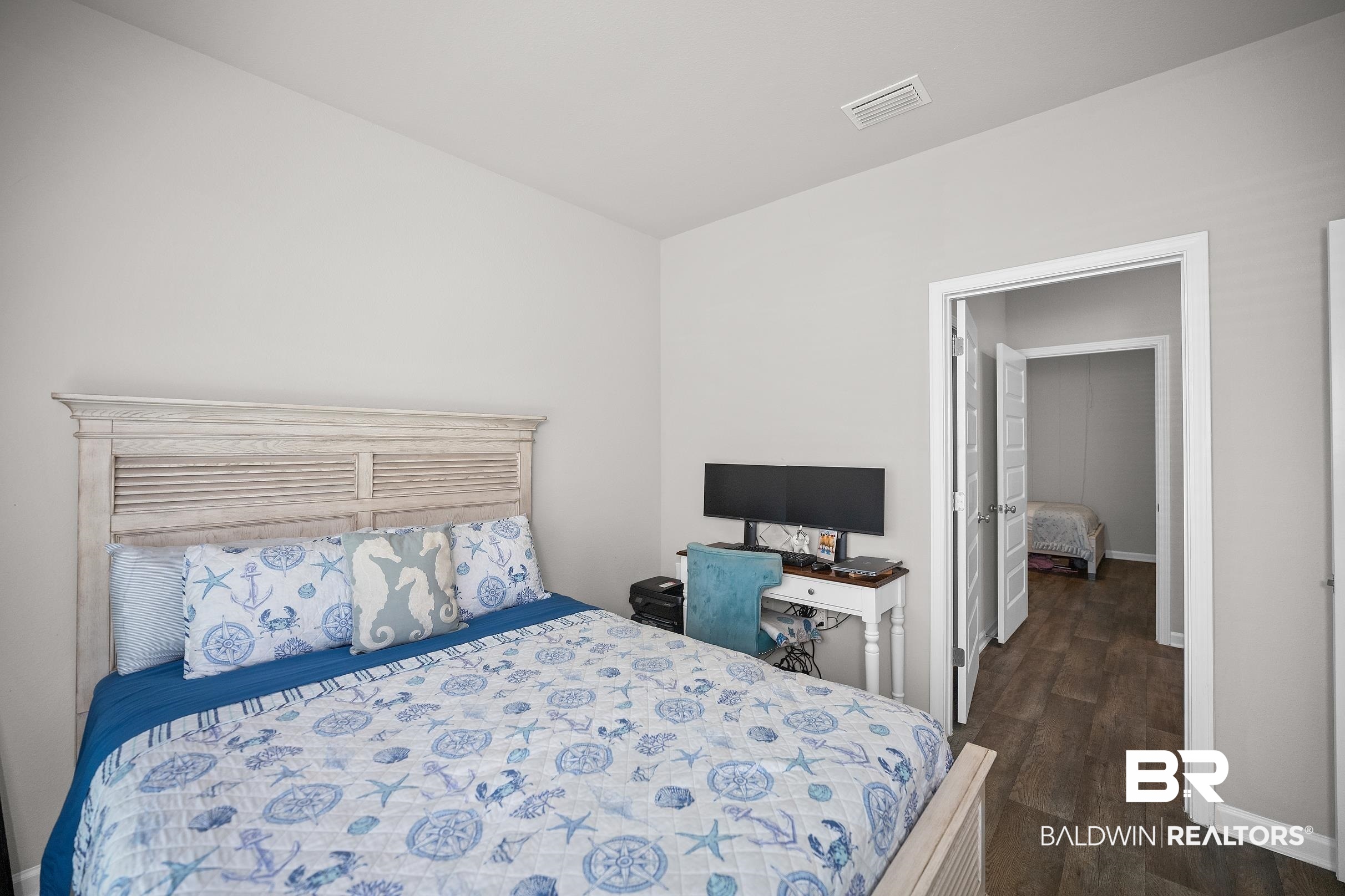23997 Veranda Circle Elberta, AL 36530 - Photo 10 of 28 Bedroom with light gray walls and wood-finish flooring